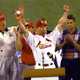 Mark McGwire celebrates with the Maris family after breaking Roger Maris’ single-season home run record.